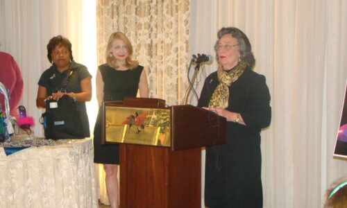Actress Patricia Clarkson looks on as her mother, New Orleans City Council President and Muses krewe member Jackie Clarkson says a few words at the Krewe of Muses news conference.